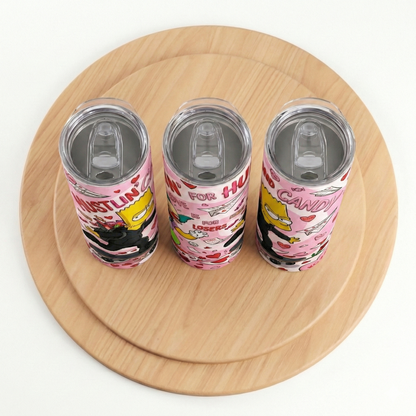 Three colorful tumblers with cartoon designs on a wooden surface