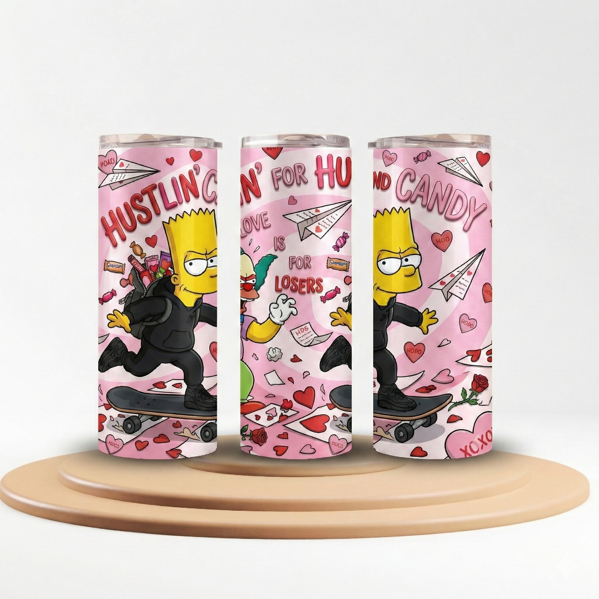 Three cylindrical cans with cartoon character designs on a white background