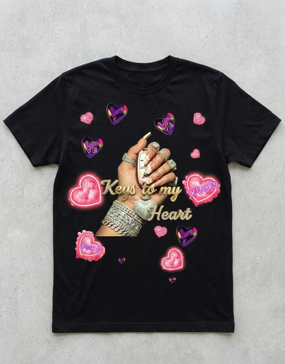 Black t-shirt with graphic of hands holding keys to my heart design on a gray background