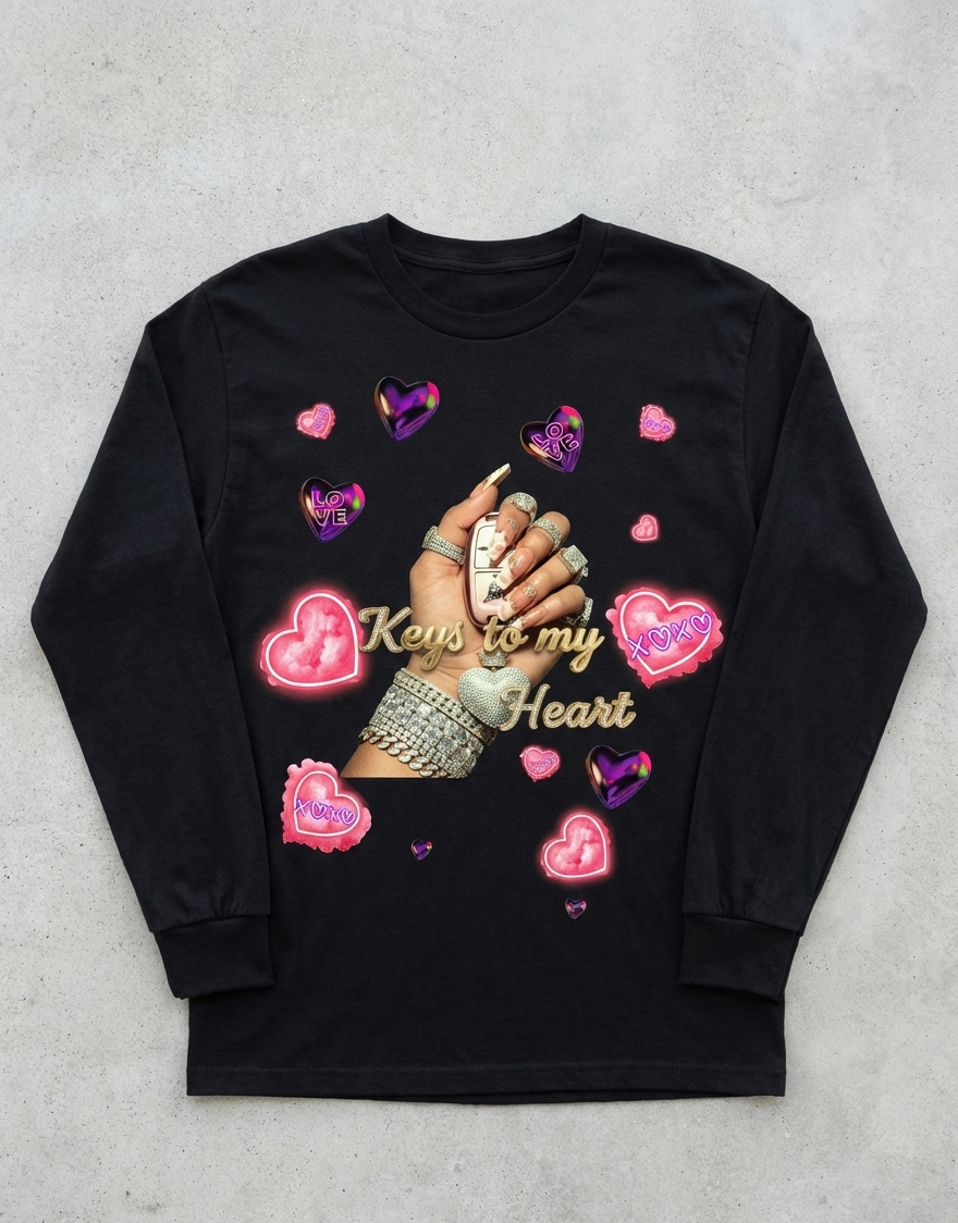 Black long-sleeve shirt with decorative design on a gray surface