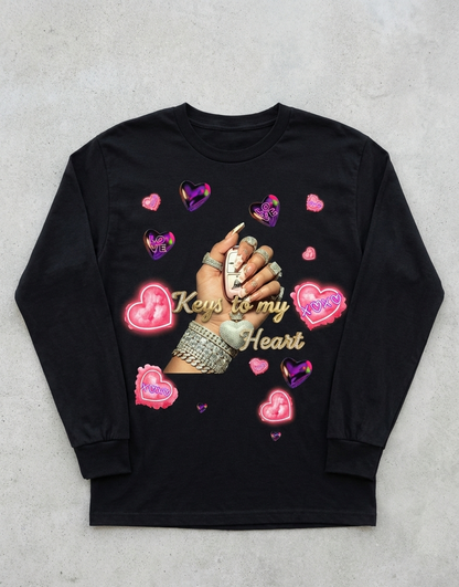 Black long-sleeve shirt with decorative design on a gray surface