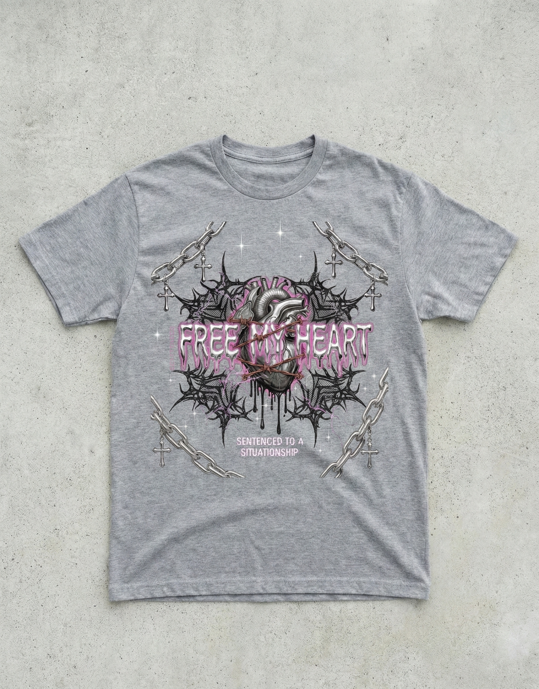 Gray t-shirt with a graphic design on a concrete surface