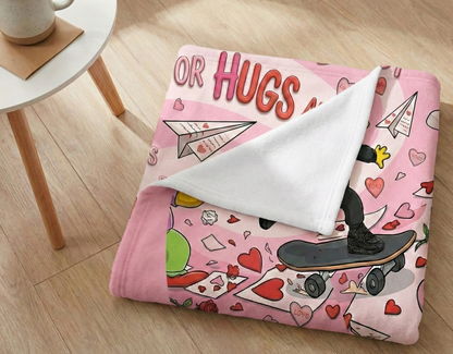 Pink blanket with cartoon design on a wooden floor