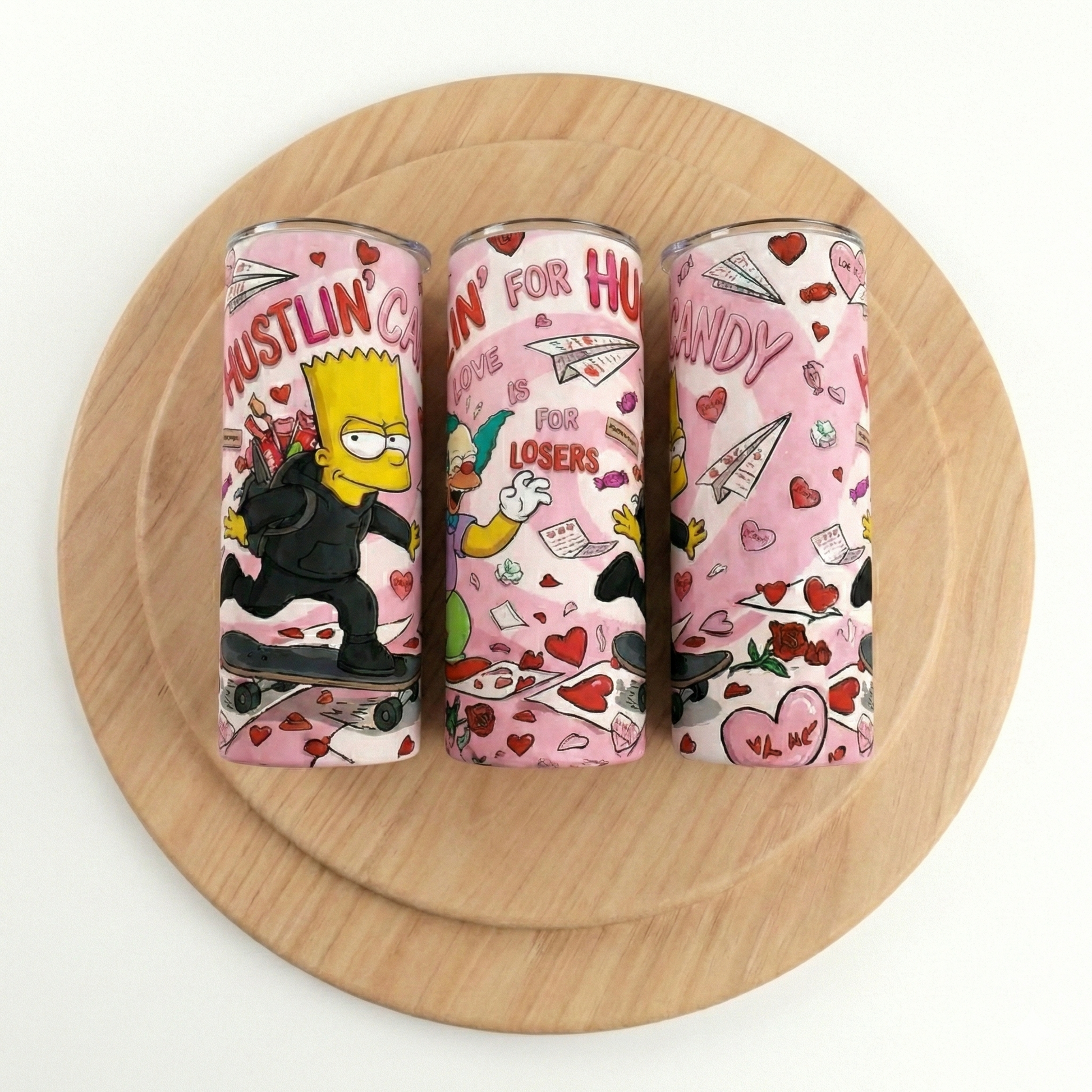Three lip balm tubes with cartoon character designs on a wooden stand.