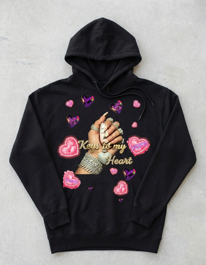 Black hoodie with graphic design of a hand holding keys and hearts on a light gray background