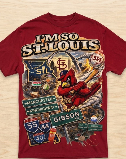 Red t-shirt with St. Louis-themed graphics and text on a wooden surface
